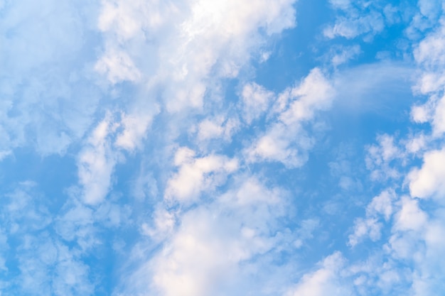 Textured background with blue sky and tiny clouds, stock photo