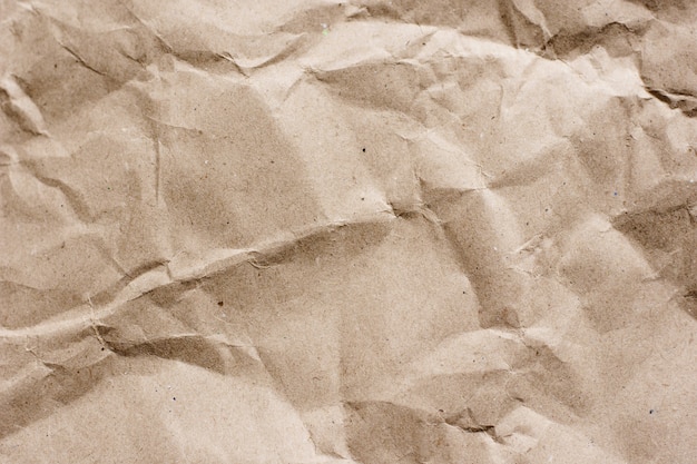 Textured brown craft paper close-up background copy space