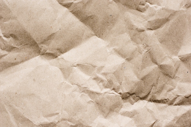 Textured brown craft paper close-up background copy space