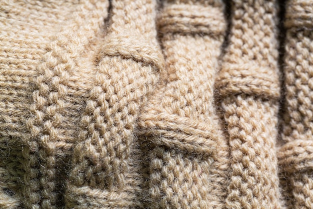 textured macro brown sweater,Seamless texture of handmade knitting of natural yarn. Sheep common