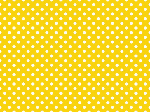 Photo texturised white color polka dots over gold yellow background