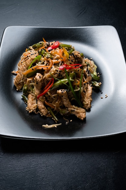 Thai cuisine restaurant food menu. noodle beef meat vegetable on a plate.