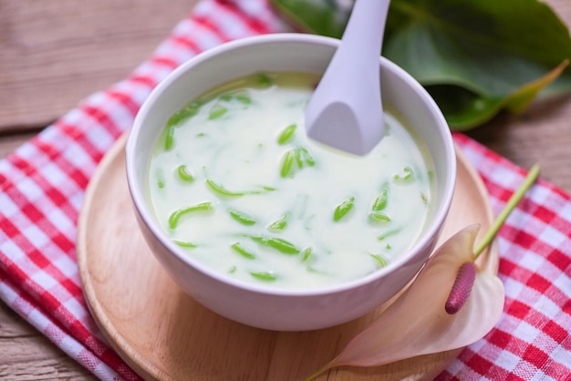 Thai dessert Thai rice flour pandan leaf with coconut milk and syrup sweets dessert on white bowl Asian food