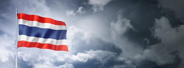 Thai flag on a cloudy sky