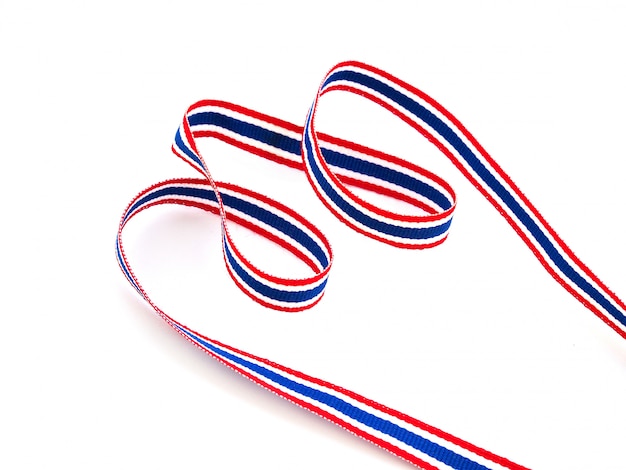 Thai flag ribbon with red, blue and white stripes, Symbols of Asian countries isolated on white surface.