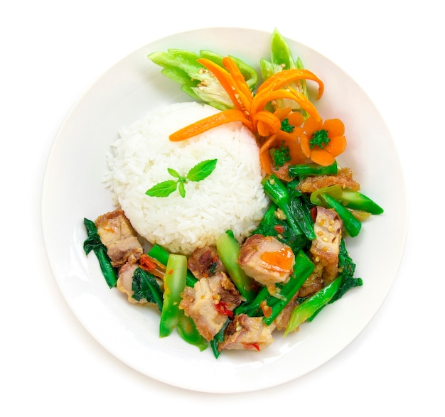 Thai food Stirfried Crispy Pork spicy and Chinese kale served with rice  