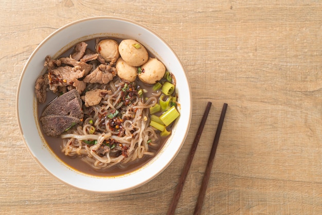 Thai noodle with pork stewed pork meatball and pork liver in blood soup