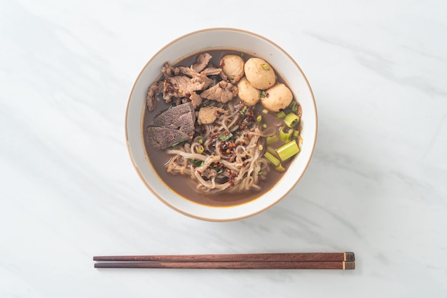 Thai noodle with pork stewed pork meatball and pork liver in blood soup