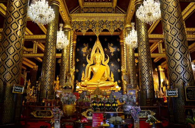 Thai people praying Buddha statue name Phra phuttha chinnarat at Wat Phra Sri Rattana Mahathat on August 28 2015 in Phitsanulok Thailand