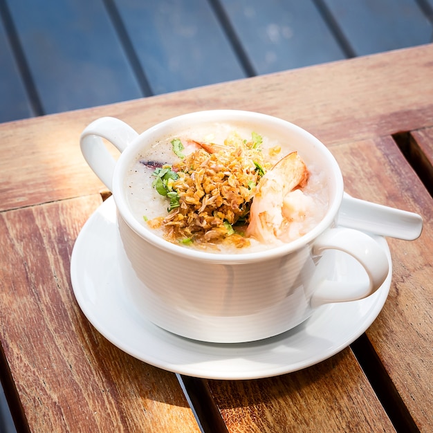 Thai rice soup with shrimps on the Thai breakfast table