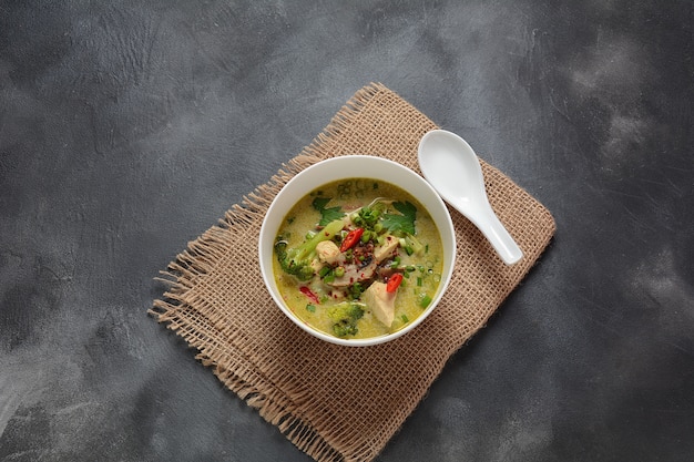 Thai  Spicy Green curry chicken soup   with coconut milk, mushrooms and broccoli.