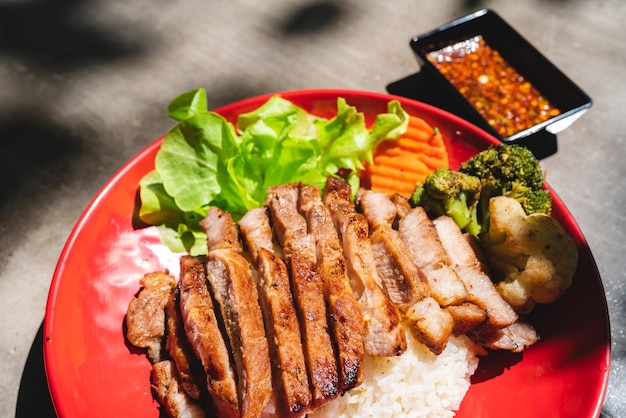 Thai style grilled pork with rice and vegetable meal meat for dinner or lunch main dishes