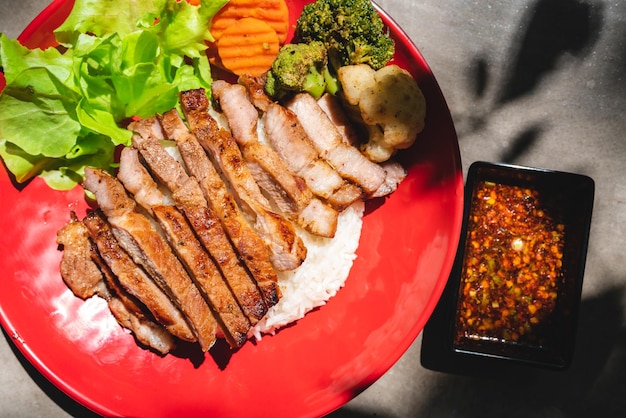 Thai style grilled pork with rice and vegetable meal meat for dinner or lunch main dishes