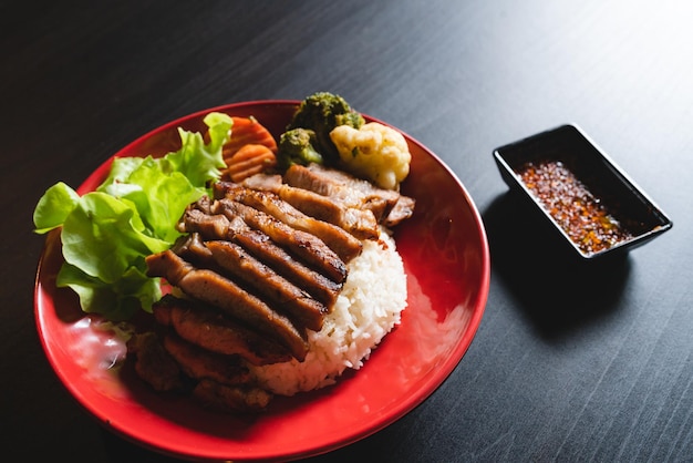 Thai style grilled pork with rice and vegetable meal meat for dinner or lunch main dishes