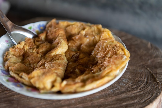 Thai style omelet in Thai street food restaurant