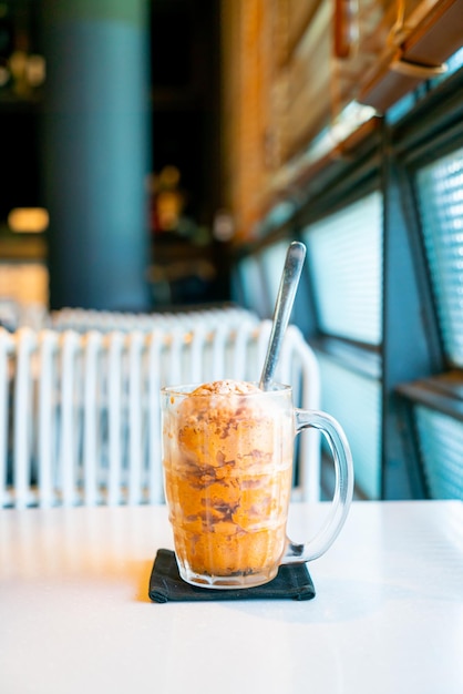 Thai tea ice scoop in glass