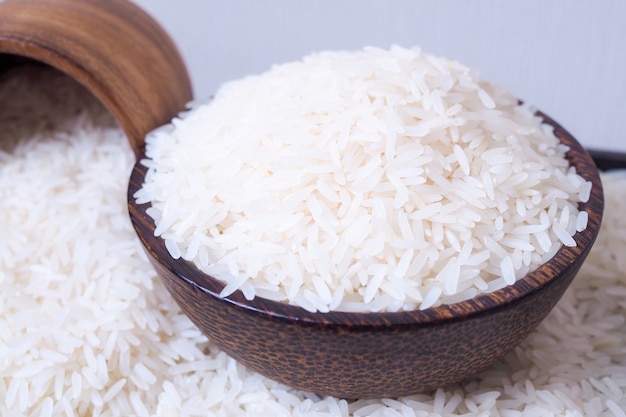 Thai white jasmine rice put in wooden bowl