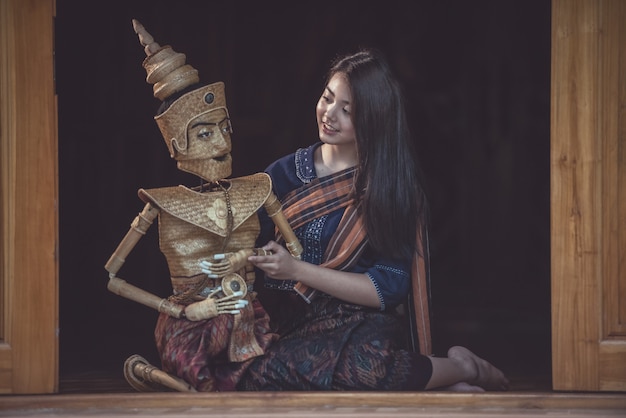 Thai woman using traditional puppet