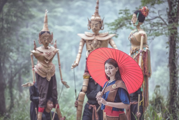 Thai woman with traditional puppets