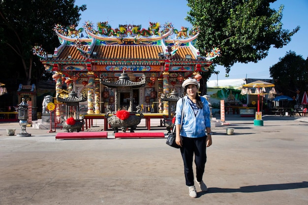 Thai women visit respect pray at San Chao Pu Ya chinese temple or great grandfather and grandmother ancestor shrine on December 19 2017 in Udon Thani Thailand