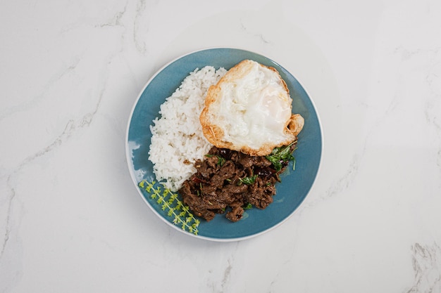 Thailand Food : stir-fried with beef and basil on green plate thai food concept.Thai street food