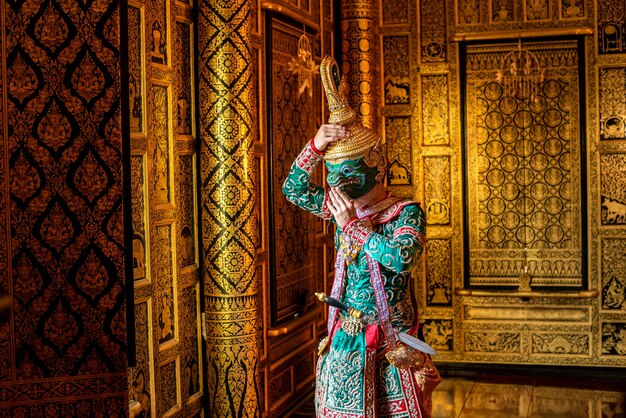 Thailand typical dancer with typical clothes on gold walls background