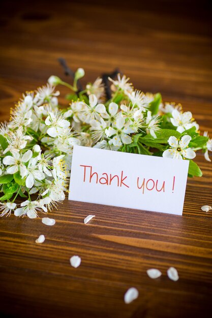 Thank you card and blooming spring branch with flowers