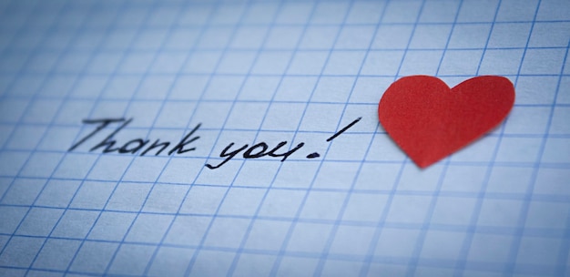 Thank you lettering and red heart on checkered paper