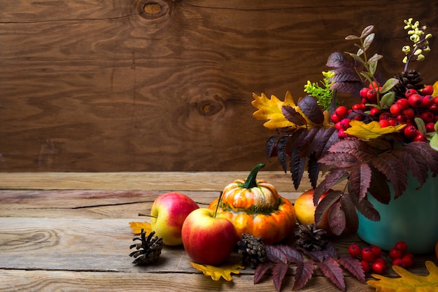 Thanksgiving arrangement with rowan in turquoise vase, 