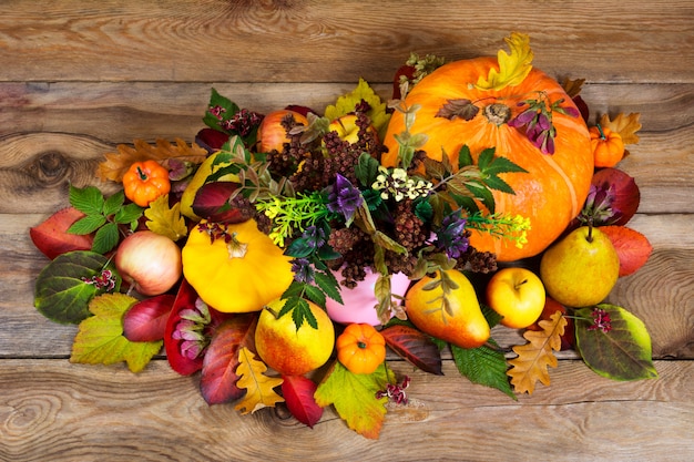 Thanksgiving arrangement with wild flowers, pumpkins, apples, pears 