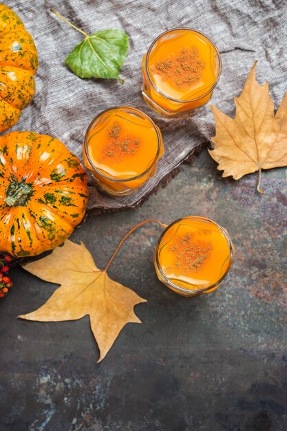 Thanksgiving autumn alcohol drink cocktail beverage with pumpkins and leaves