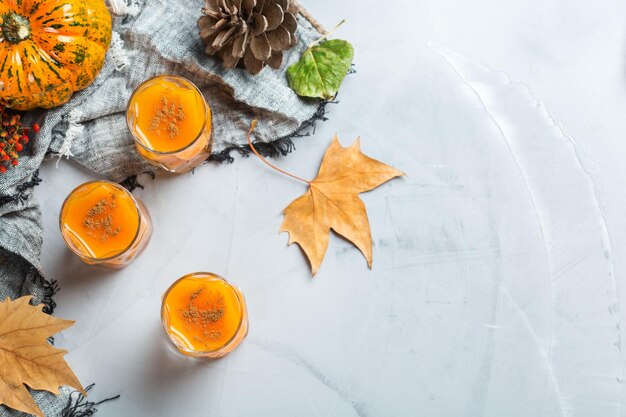 Thanksgiving autumn alcohol drink cocktail beverage with pumpkins and leaves