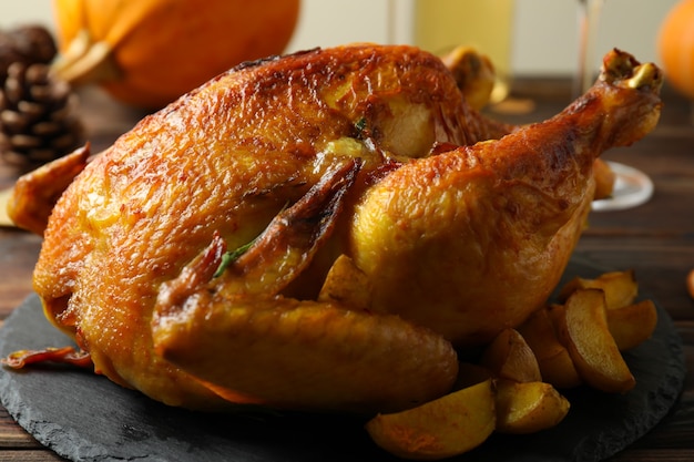 Thanksgiving Day roast turkey on wooden table