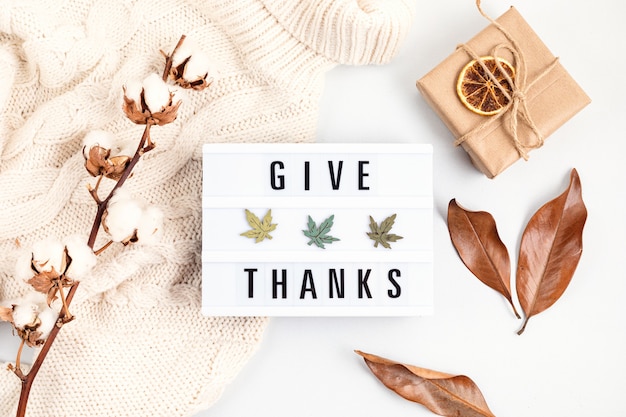 Thanksgiving flat lay composition with lightbox with the phrase Give thanks