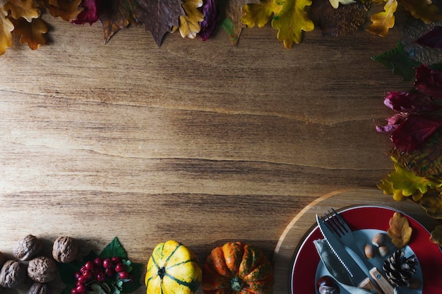 Thanksgiving pumpkins with fruits and falling leaves