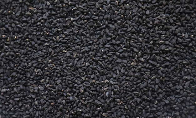 There are many black cumin seeds. Selective focus. nature.