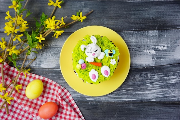 There is a plate with an Easter cake on the table