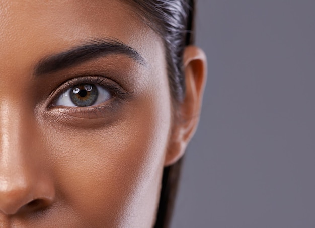 Theres inner beauty behind those eyes Closeup portrait of a beautiful young woman in the studio