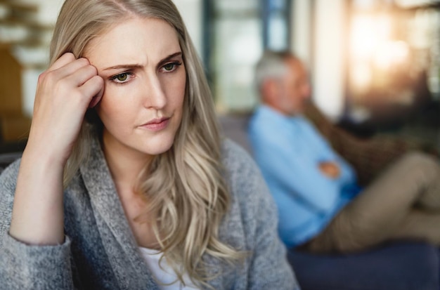 Theres a wall between their marriage Cropped shot of a woman looking despondent after having a fight with her husband at home