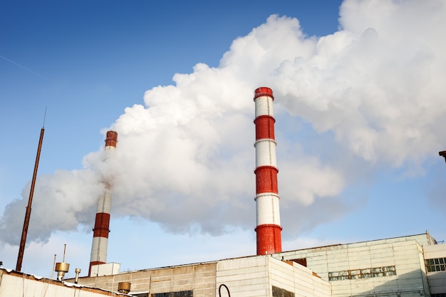 Thermal power plant against cloudy blue sky