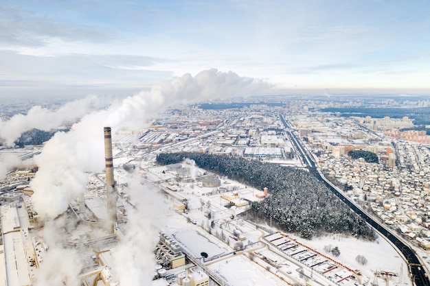 Thermal power plant in winter in the city of Minsk. Smoke is coming from the big Chimneys.