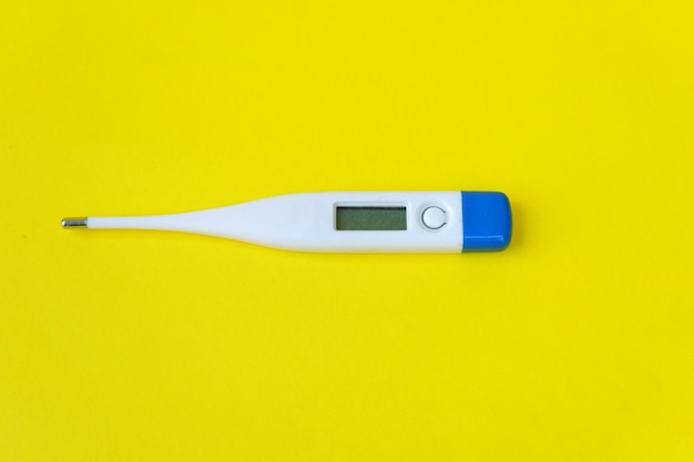 thermometer isolated on yellow background