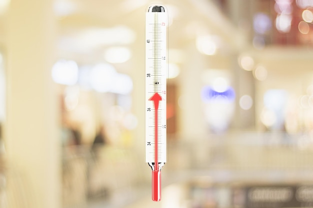 Photo thermometer with red mercury arrow growing up