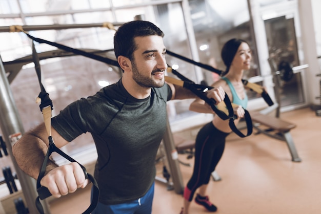 They are in the gym and focused on the exercises.