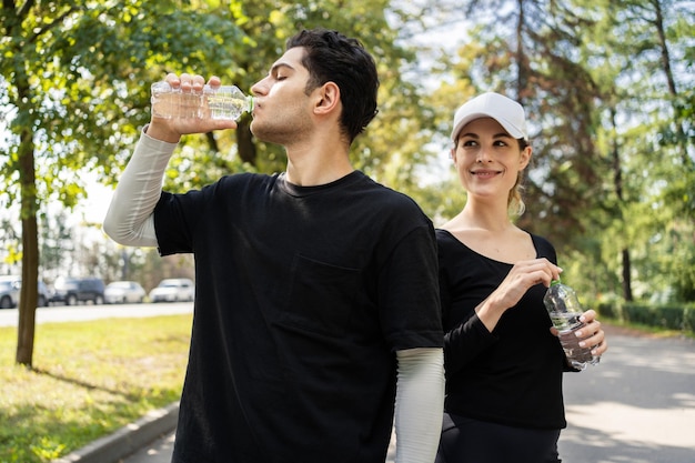 They drink clean water from plastic bottles People athletes are happy to prepare for training