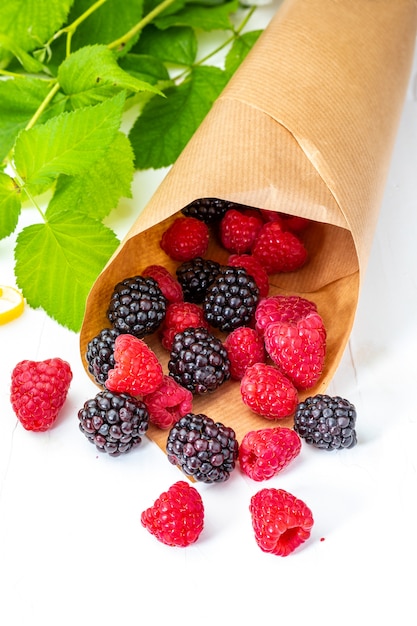 They look like artificial treats! But they are delicious and beautiful blackberries and fresh raspberries.