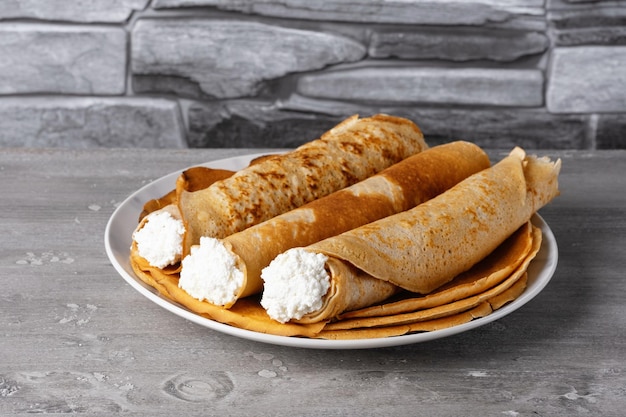 Thin pancakes with cottage cheese Healthy traditional breakfast concept