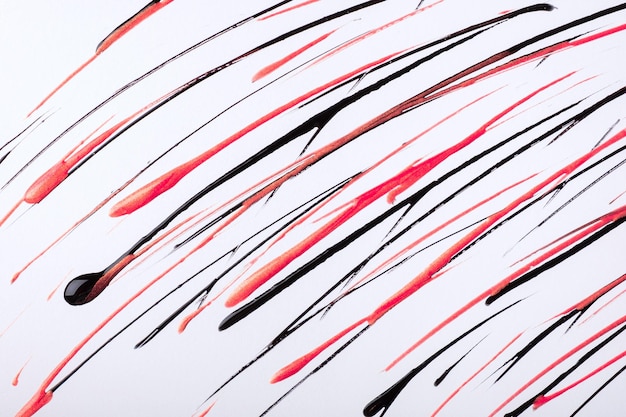 Thin red and black lines and splashes drawn on white background Abstract art backdrop with rose brush decorative stroke Acrylic painting with graphic stripe