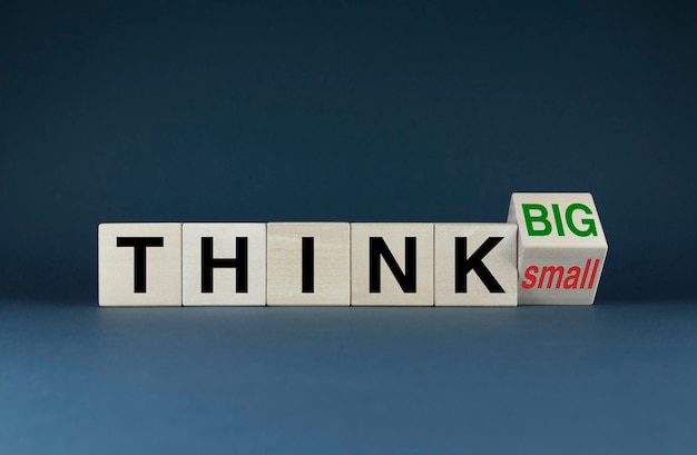 Think Big or Think Small The cubes form the choice words Think Big or Think Small