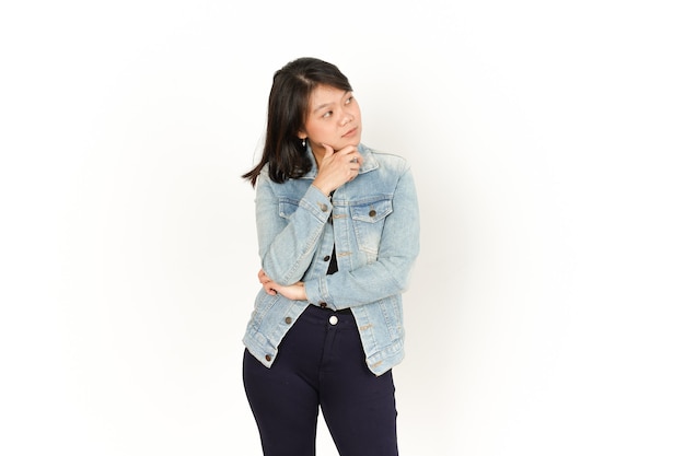 Thinking of Beautiful Asian Woman Wearing Jeans Jacket and black shirt Isolated On White Background